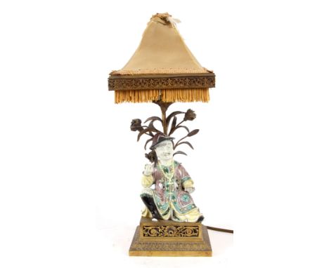 A 19TH CENTURY ORMOLU TABLE LAMP MOUNTED WITH A CHINESE PORCELAIN&nbsp;FIGURE 40cm high.