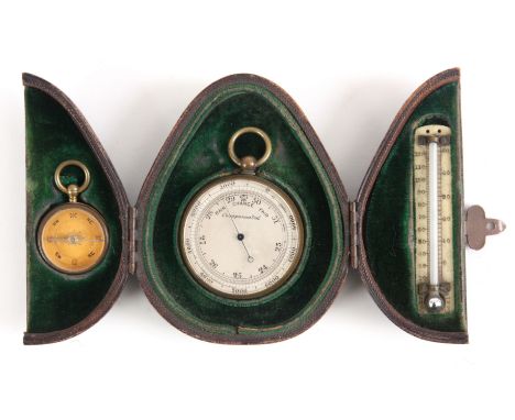 A LATE 19th CENTURY POCKET BAROMETER AND COMPASS TRAVEL SET the barometer with silvered engraved calibrated dial in gilt bras