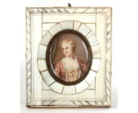 A 19th CENTURY MINIATURE PORTRAIT ON IVORY of a young woman with floral dress mounted in glazed ivory engraved frame 9.5cm hi