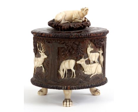 A FINELY CARVED 19th CENTURY SOUTH GERMAN IVORY, ANTLER AND BURR WOOD TEA CADDY/CASKET with a lift of lid mounted with a seat