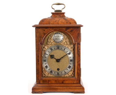 CAMERER CUSS & CO. LONDON, A 17TH CENTURY STYLE FIGURED WALNUT INVERTED BELL TOP MANTEL CLOCK the arch brass and silvered dia