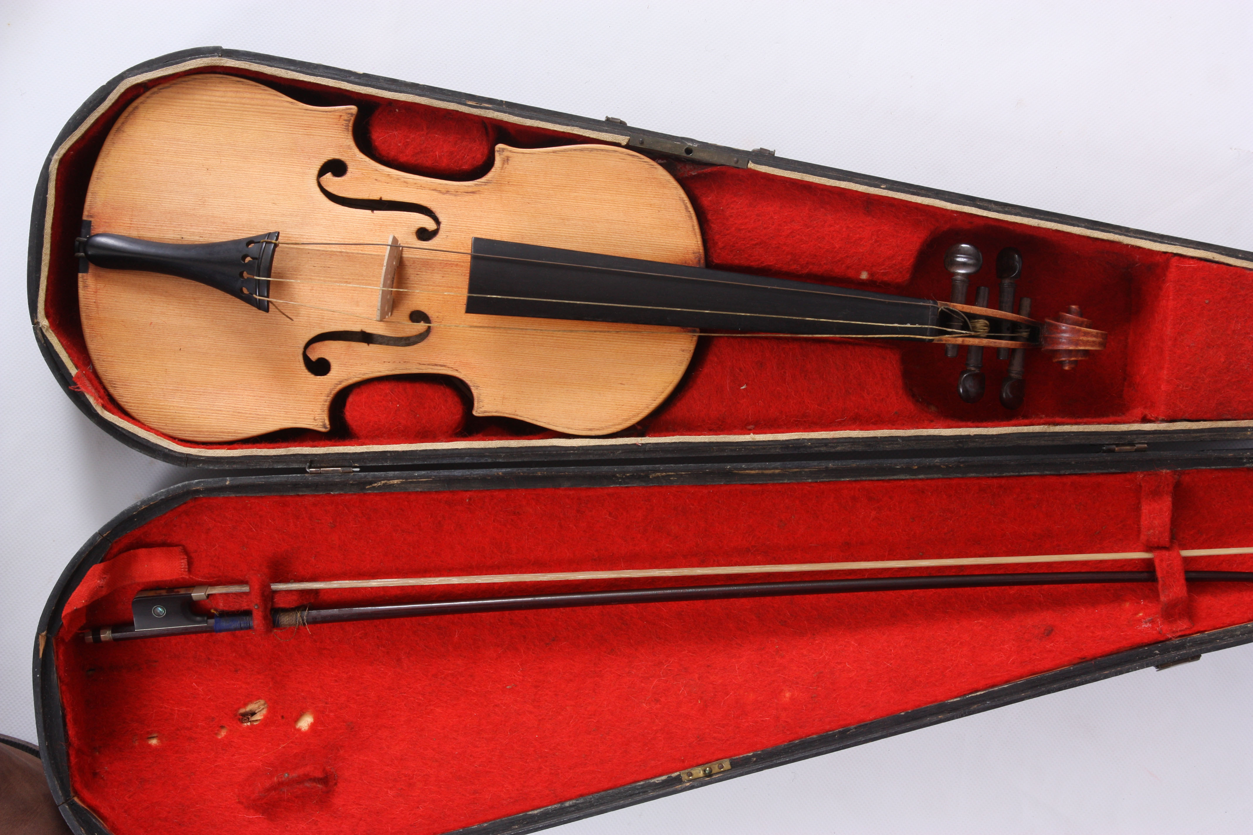 AN INTERESTING COLLECTION OF NINE ANTIQUE VIOLINS seven in cases