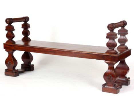 A FINE LATE REGENCY COUNTRY HOUSE HALL BENCH OF GENEROUS SIZE having a moulded&nbsp;edge one-piece top with stylish scrolled 