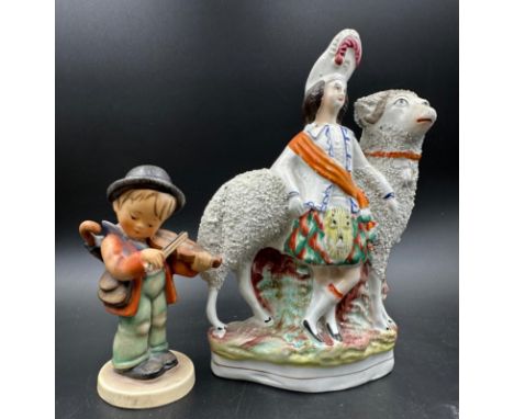 A Staffordshire flatback and a Hummel figure