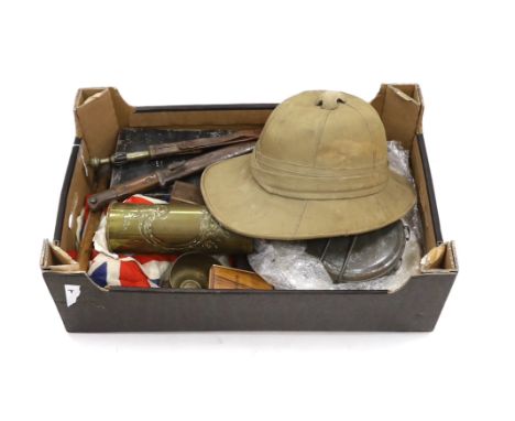 A collection of militaria including; a pith helmet, a T.G. Co. Ltd. Mk.III compass, a cased protractor, a Union flag, a trenc