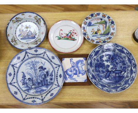 Two 18th century Delft blue and white dishes, a Delft polychrome dish, an English delftware plate, a Delft equestrian tile an