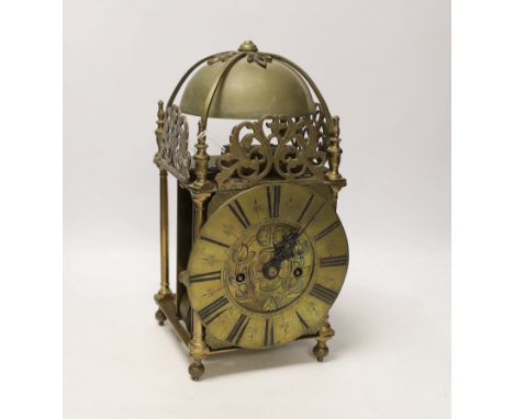 A double fusee brass lantern clock, 32cm high The pendulum is present. The suspension spring has broken, therefore is not pos