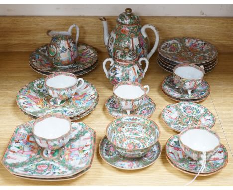 A Chinese famille rose part tea set including: five cups saucers and side plates, a teapot and cover, sugar bowl and cover, a