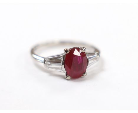 A white metal ruby ring with diamond set shoulders, housed in a Chow Tai Fook box gross weight 3.1grams