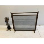 A spark guard, minimum width 90cm, depth 18cm, height 80cm and fire irons in antique distressed