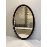A large bespoke oval brass mounted mahogany mirror by Archer and Smith, width 118cm, height 179cm,