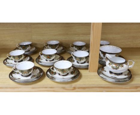 A Japanese Noritake floral and gilt tea set, comprising a sugar bowl, a milk jug, nine cups, plus saucers and tea platesFive 