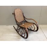 An early 20th century caned Thonet bentwood rocking chair, width 49cm, depth 90cm, height 87cm