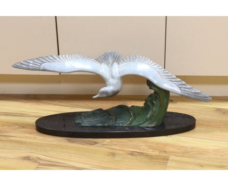 M. Leducq, a painted spelter model of a gull in flight on marble base, 86cm wingspan