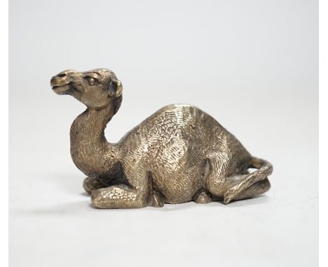 An Elizabeth II miniature silver model of a recumbent camel, by Stuart Devlin, London, 1979, length 58mm.