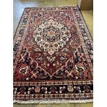 A North West Persian red ground carpet, 306 x 194cm