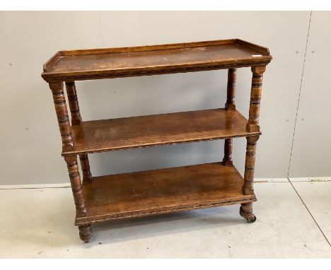 A late Victorian oak three tier buffet, width 99cm, depth 40cm, height 100cm