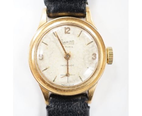 A lady's Swiss Sabina 18k manual wind wrist watch, on a leather strap.