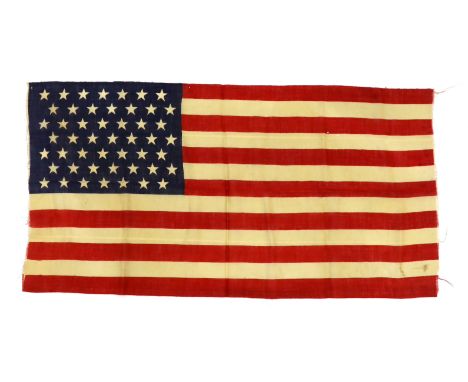 A 1959 USA flag, ‘Stars and Stripes’ printed on light open woven material, forty-nine stars, seven red stripes and six white 
