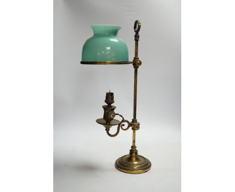A brass desk lamp with green glass shade, circa 1920’s