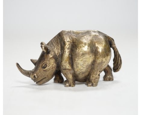 An Elizabeth II silver miniature model of a rhinoceros, by Stuart Devlin, London, 1985, length 55mm.