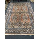 A North West Persian style pale red ground carpet, 250 x 154cm