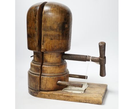 A vintage miliner's hat mould, 35cm high