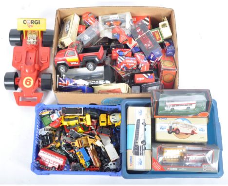 A large collection of assorted loose and boxed diecast model cars, trucks and farming / construction vehicles of various scal