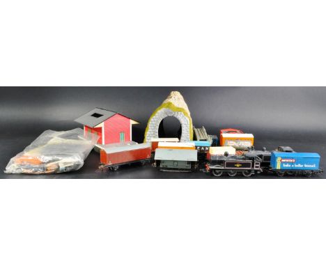 A collection of assorted 00 gauge model railway trainset locomotives, rolling stock wagons and other accessories. Examples to