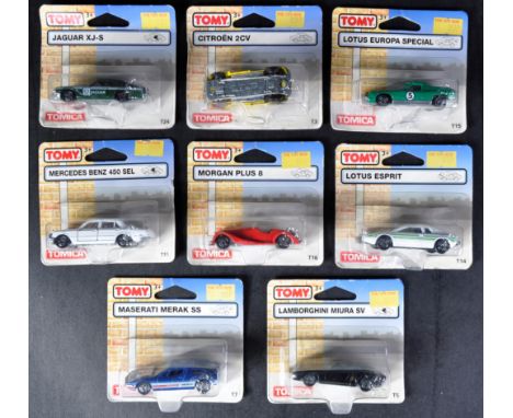 A collection of x8 carded Tomica made diecast model cars to include; T15 Lotus Europa Special, T19 Mercedes Benz 450 SEL, T24