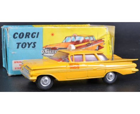 An original vintage Corgi Toys boxed diecast model No. 221 Chevrolet New York Taxi Cab. The model retaining original sticker 