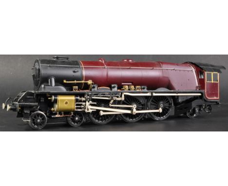 A highly detailed brass kit built O gauge model railway trainset locomotive with tender. A 4-6-2 example with maroon livery. 