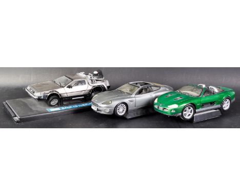 A collection of x3 assorted 1/18 scale diecast model cars comprising a Sun Star made Back To The Future Delorean and x2 James