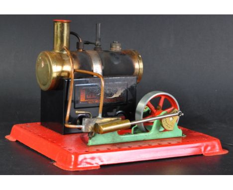 An original vintage Mamod made tinplate live steam S.E.2. / SE2 Stationary Engine. The model on a red tinplate base with bras