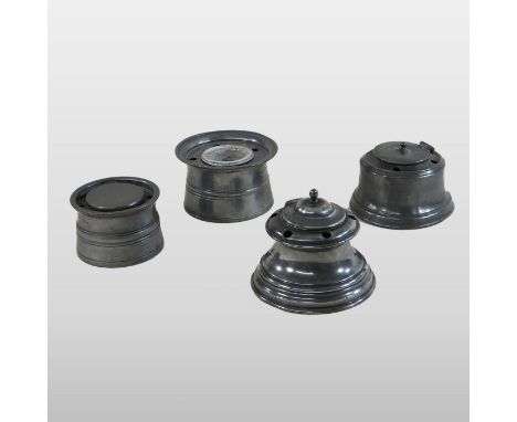 A Victorian pewter inkwell, of hinged circular shape, 11cm diameter, together with three others (4)