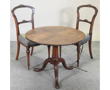 A George III mahogany tripod table, 75cm diameter, together with a pair of Victorian chairs