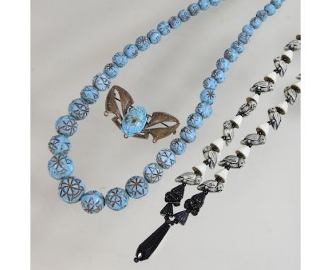 A vintage art deco style glass bead necklace, together with a parrot glass necklace and an egyptian revival scarab brooch