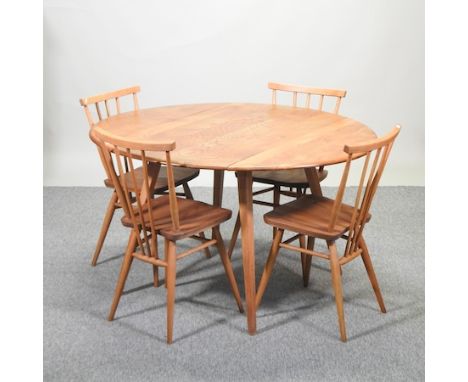 An Ercol medium elm drop leaf dining table, 114 x 125cm overall, together with a set of four stick back chairs