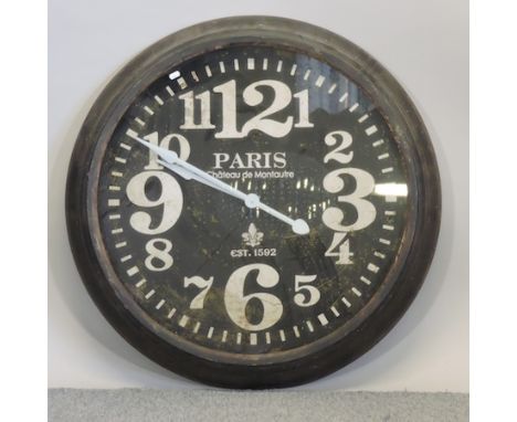 A black painted wall clock, 93cm diameter