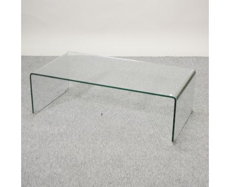 A vintage designer glass coffee table, 110cm