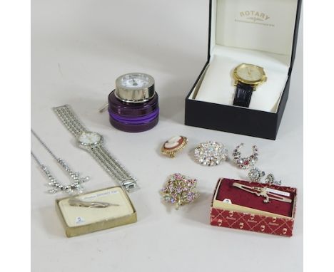 A Rotary wristwatch, boxed, together with a travel clock and costume jewellery brooches