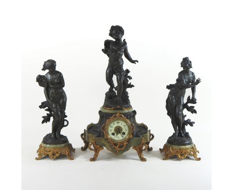 A 19th century French figural three piece clock garniture, with a drum movement, striking on a bell, by Medallie D'argent, da