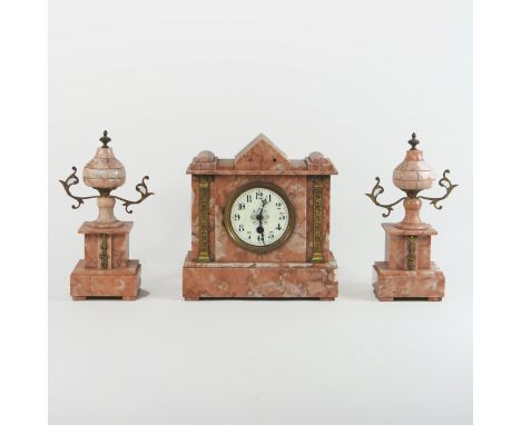 A 19th century continental rouge marble and gilt metal mounted three piece clock garniture, of architectural form, the enamel