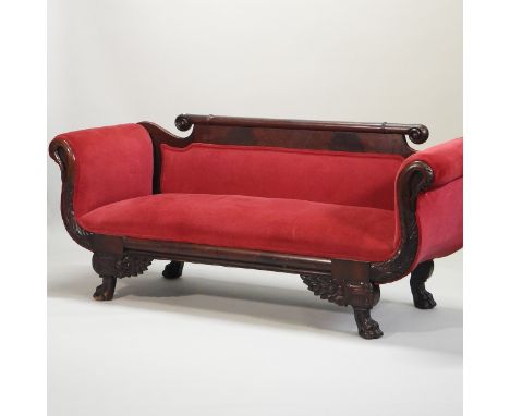 A 19th century continental carved mahogany and red upholstered scroll end sofa, with a scrolled back and stylised swan suppor