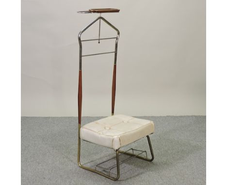 A vintage brass and cream upholstered valet stand
