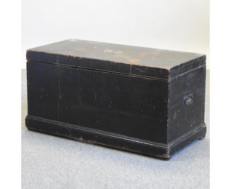 An early 20th century black painted pine trunk, 97cm