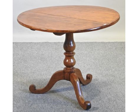 A 19th century circular tilt top occasional table, on a tripod base, 89cm