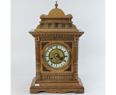 A walnut cased mantel clock, 50cm high