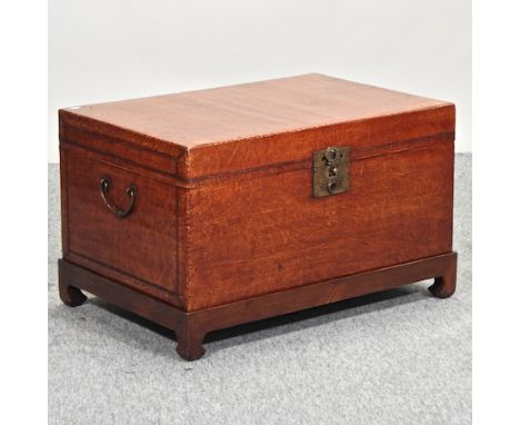 A Chinese lacquered trunk, on a stand, 74cm