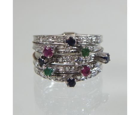 An unmarked sapphire, emerald, ruby and diamond ring, boxed